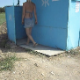 We follow a blonde woman into a beach outhouse as she takes a piss and a shit. She quickly leaves, and we get a glimpse of the nasty pit beneath. About 2 minutes.